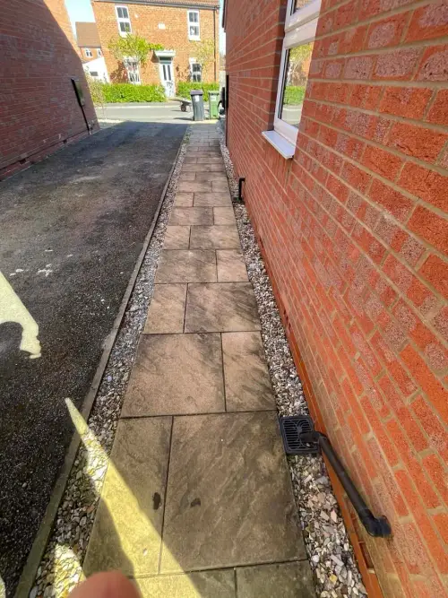 Side of house paved path with gravel edging