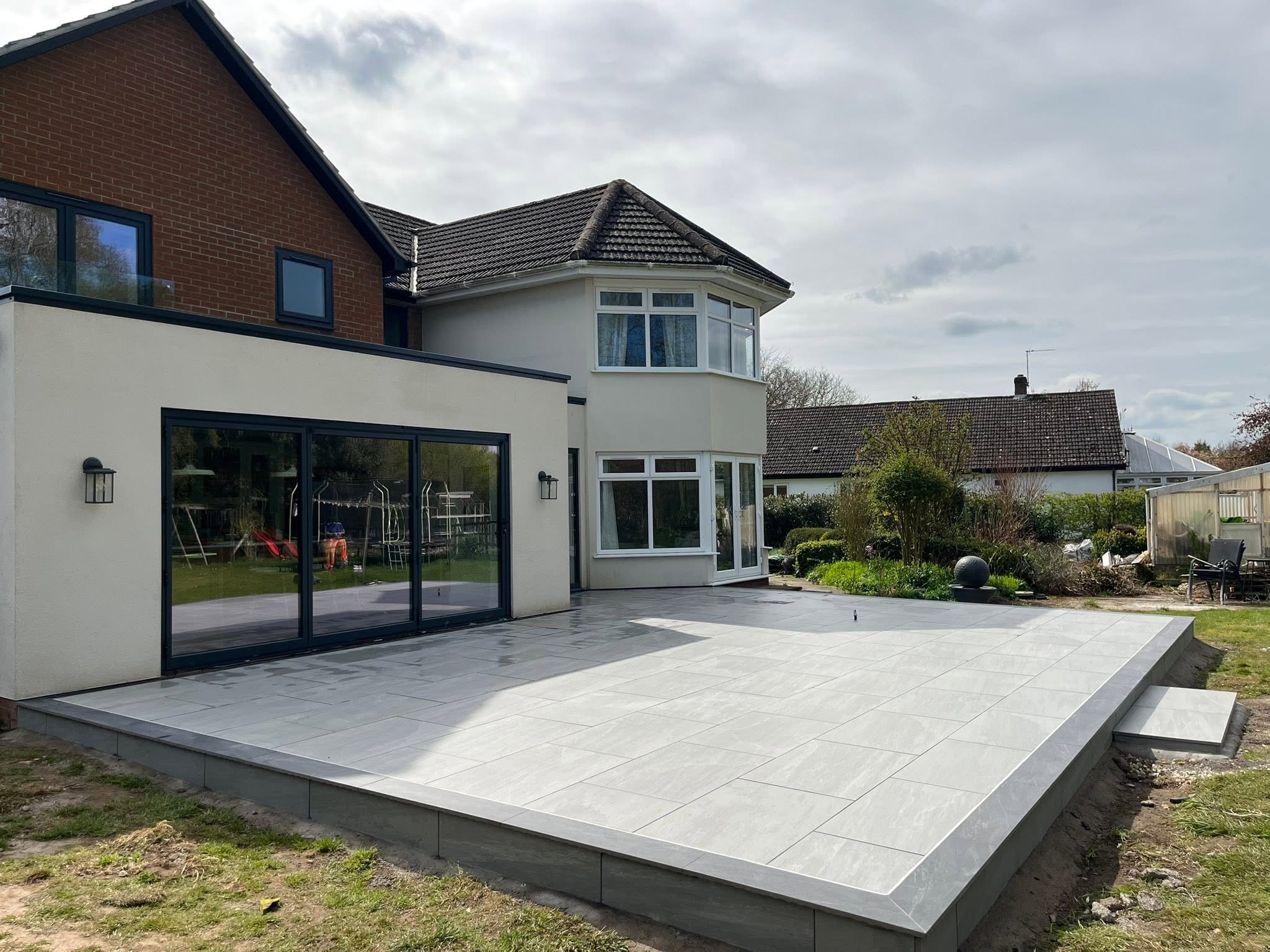 Raised grey porcelain patio